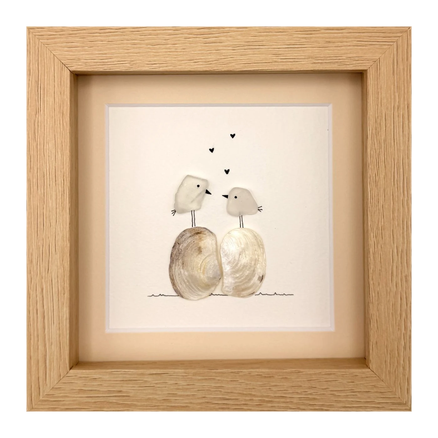Two white birds with hearts
