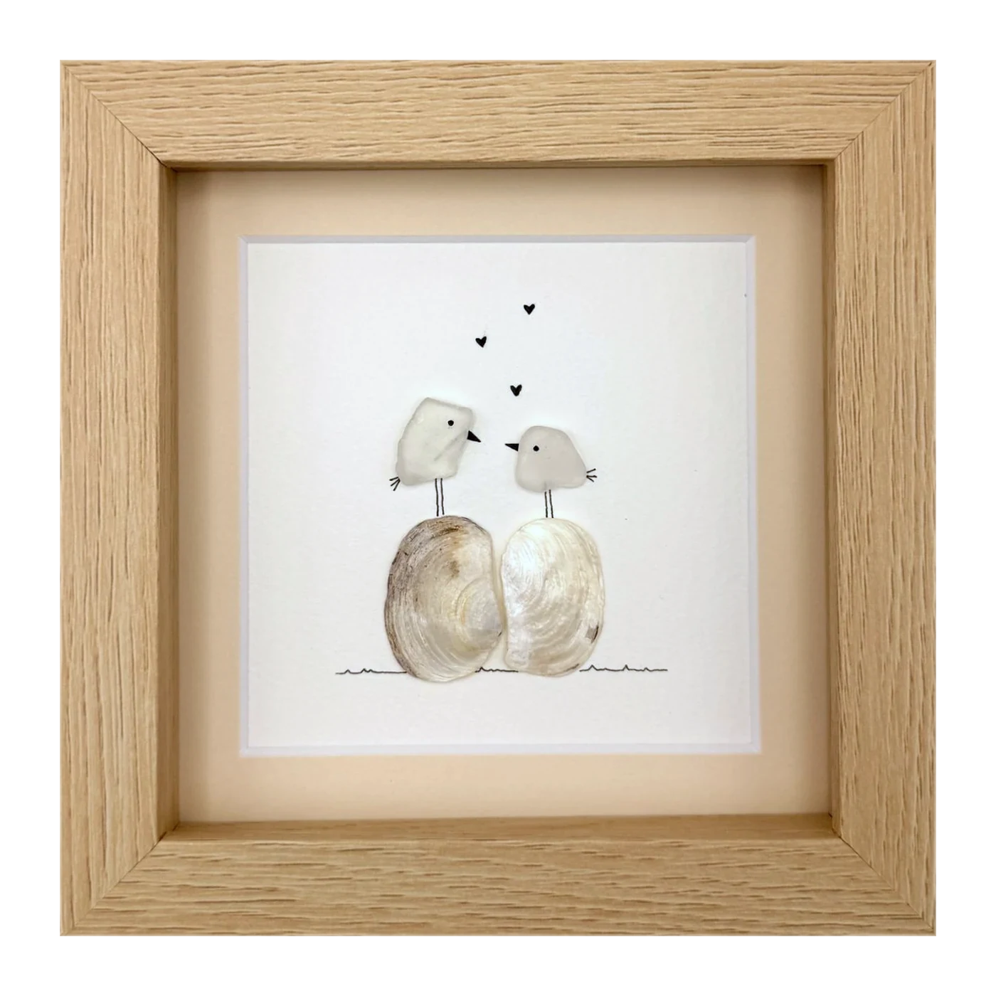 Two white birds with hearts