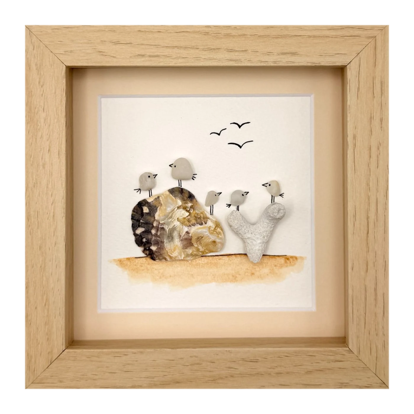 Five sea glass birds on shell and coral