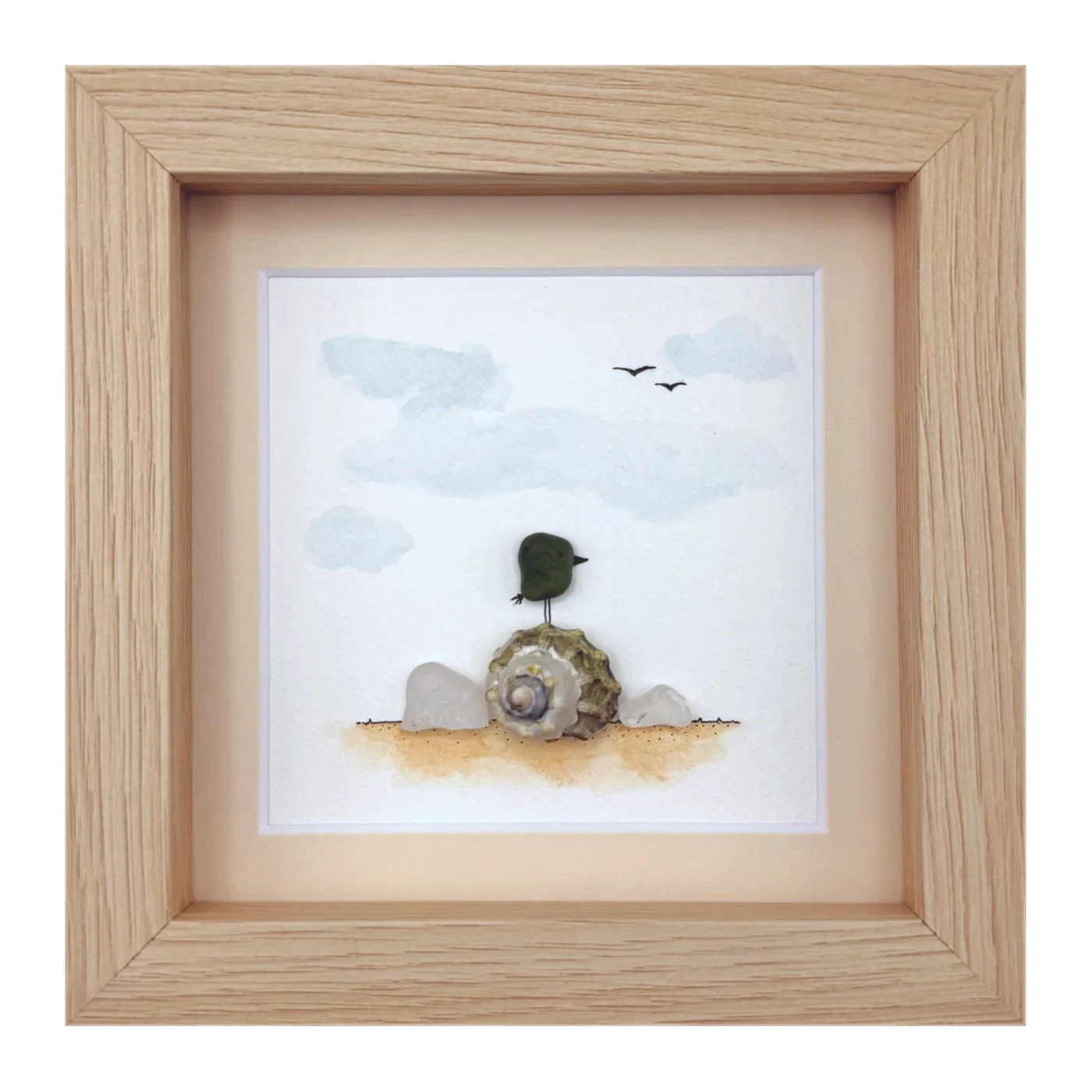 Green sea glass bird on a snail shell
