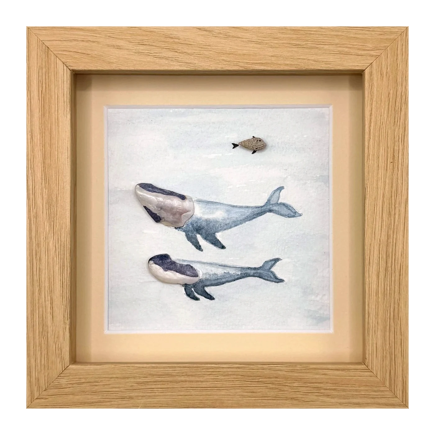 Two shell whales with a small fish above them