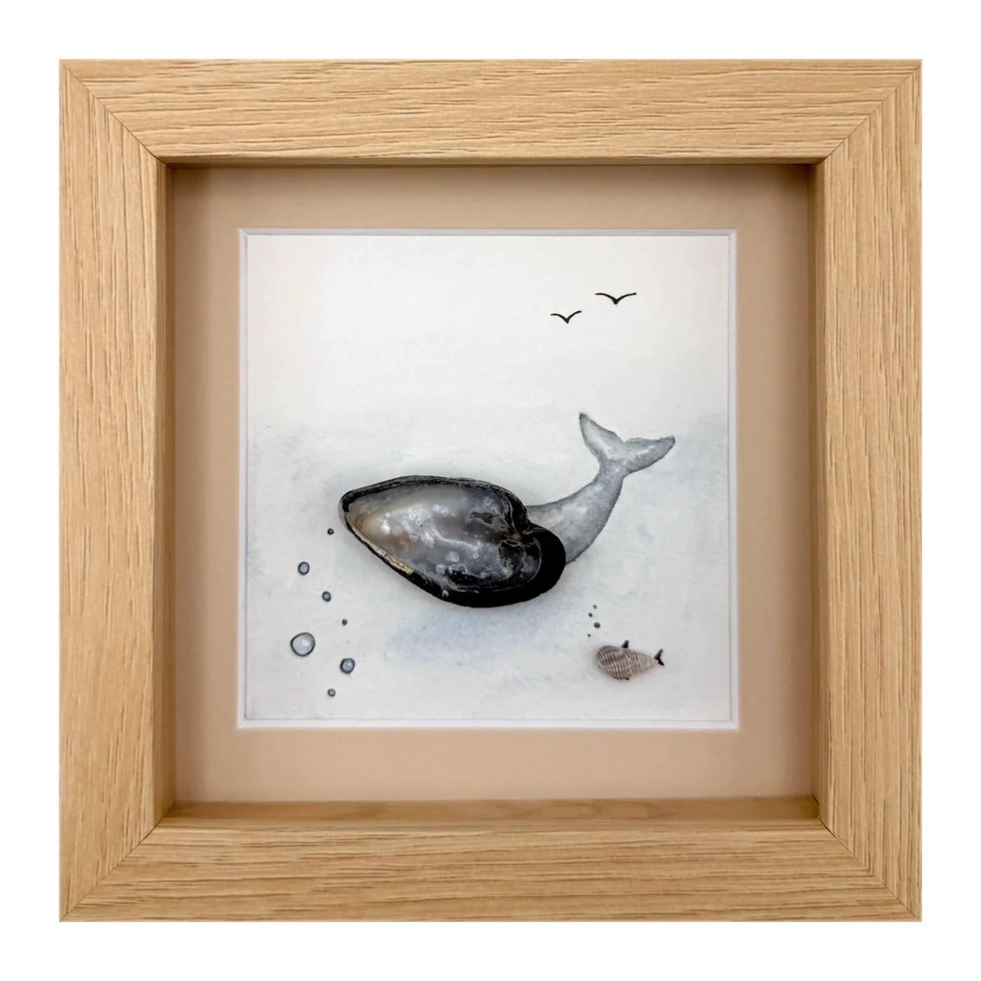 A mussel shell whale with a small fish